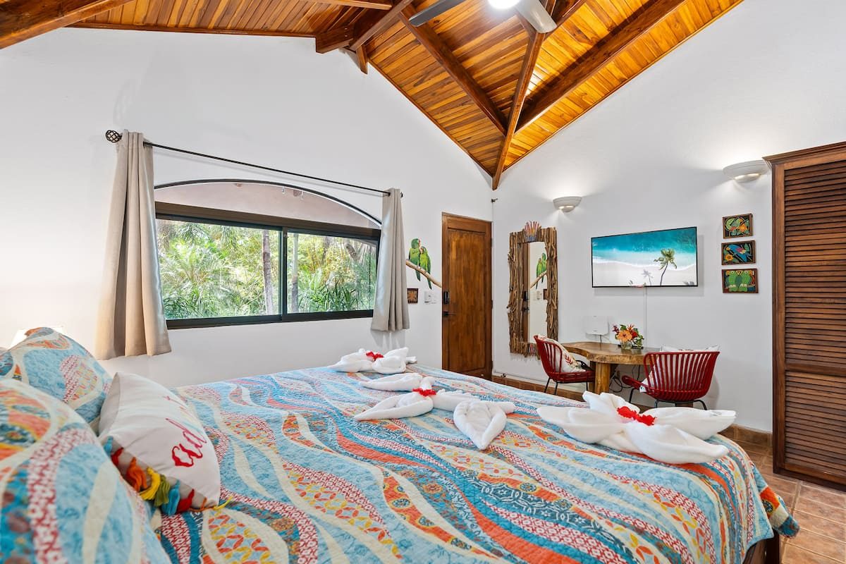 Cosy bedroom inside one of the three jungle studio cabinas